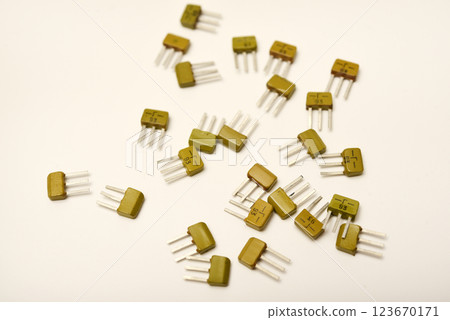 Old transistors on a white background. Electronic elements. 123670171