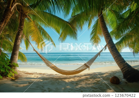 Hammock swaying between palm trees on a serene tropical island beach 123670422
