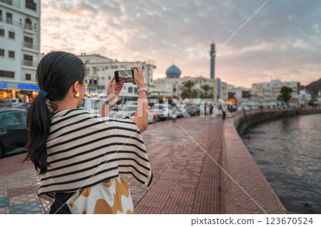 Capturing Memories at the Muttrah Corniche in Muscat, Oman at Sunset Capturing Memories at the Muttrah Corniche in Muscat, Oman at Sunset 123670524