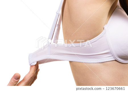 Woman wearing too big bra Woman wearing too big bra 123670661