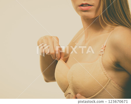 Girl wearing wrong size bra 123670671