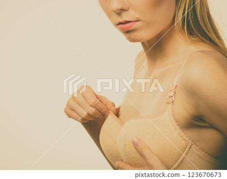 Girl wearing wrong size bra 123670673