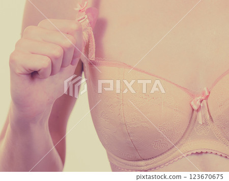 Woman wearing wrong size bra 123670675