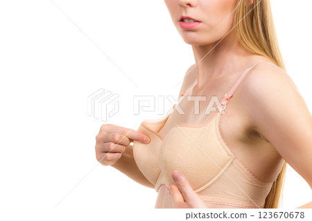 Girl wearing too big bra cup 123670678