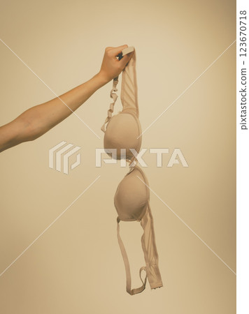 Female hand holds bra 123670718