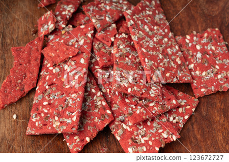 Beetroot crackers, thin rusk beet root bread, red diet multigrain crispbread, various seeds Beetroot crackers, thin rusk beet root bread, red diet multigrain crispbread, various seeds 123672727