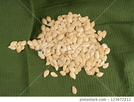 Whole Pumpkin Seeds in Shell Isolated, Raw Pepita Grains, Scattered Green Healthy Nuts 123672812