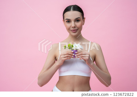 Female holding silicone container representing alternative menstrual care and hygiene Female holding silicone container representing alternative menstrual care and hygiene 123672822