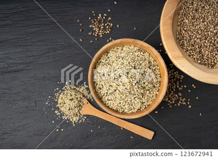 Shelled hemp seeds pile, peeled cannabis grains, marijuana kernels without peel Shelled hemp seeds pile, peeled cannabis grains, marijuana kernels without peel 123672941