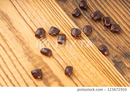 Dried tamarind seeds isolated, Tamarindus indica beans on a white background, medicine ingredient 123672950