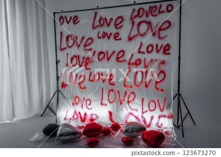 word love written on a plastic bag with an aerosol can. zone for Valentine's Day on white background 123673270