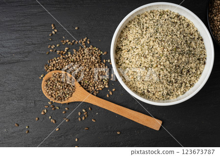 Shelled hemp seeds pile, peeled cannabis grains, marijuana kernels without peel Shelled hemp seeds pile, peeled cannabis grains, marijuana kernels without peel 123673787