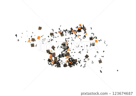Dry kelp seaweed squares, mini wakame pieces isolated, dried kombu and carrot flakes from ramen Dry kelp seaweed squares, mini wakame pieces isolated, dried kombu and carrot flakes from ramen 123674687