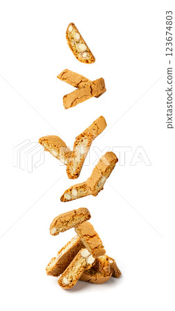 Falling biscotti di prato isolated on white background. Flying italian cantuccini nuts cookies 123674803