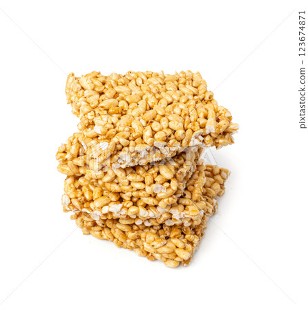 Puffed rice bar isolated, sweet wheat kozinaki, puff cereal block pieces, sugar crispy wheat bar, healthy popped dessert Puffed rice bar isolated, sweet wheat kozinaki, puff cereal block pieces, sugar crispy wheat bar, healthy popped dessert 123674871