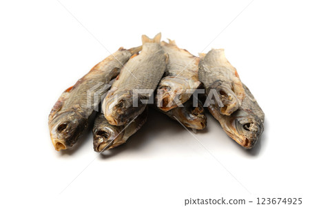 Dry roach, salted fish isolated, dried rutilus, taranka beer snack, whole salted and dried fish, prepared seafood Dry roach, salted fish isolated, dried rutilus, taranka beer snack, whole salted and dried fish, prepared seafood 123674925