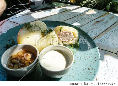Lithuanian potato dumplings, cepelinai pancakes or kolduny, meat stuffed draniki, traditional didzkukuliai Lithuanian potato dumplings, cepelinai pancakes or kolduny, meat stuffed draniki, traditional didzkukuliai 123674957