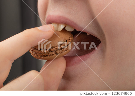 Child is Eating Macaron Cake, Macaroon Cookie, Almond Meringue, Sweet Macaroons Child is Eating Macaron Cake, Macaroon Cookie, Almond Meringue, Sweet Macaroons 123674960