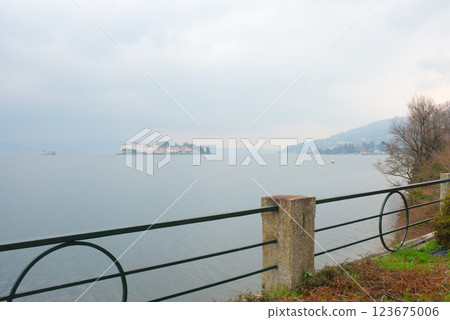 Beautiful aerial view of Lake Maggiore among the mountains, Italy. Island of Isola Bella. Morning mist. Beautiful aerial view of Lake Maggiore among the mountains, Italy. Island of Isola Bella. Morning mist. 123675006