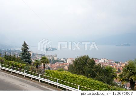 Beautiful aerial view of Lake Maggiore among the mountains, Italy. Islands of Isola Bella and Isola dei Pescatori. Cloudy day 123675007