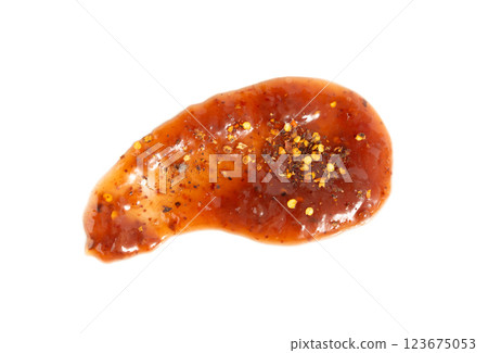 Orange jam with chili isolated, strawberry chilli pepper marmalade smear, spicy fruit jelly fruity confiture 123675053