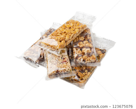 Nut Bar in Plastic Package Isolated, Energy Snack with Nuts, Muesli, Protein Candy Bar, Fitness Fruit 123675076