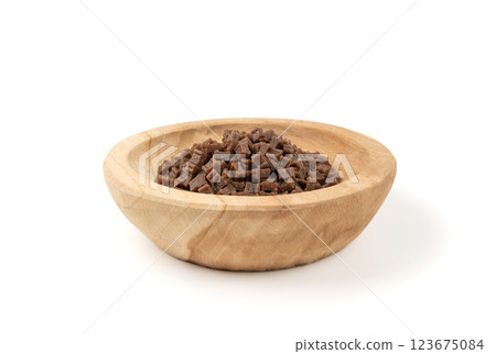 Mini bone-shaped pet food, small dogs crunchy treats, flavored brown dry kibble, canine food Mini bone-shaped pet food, small dogs crunchy treats, flavored brown dry kibble, canine food 123675084