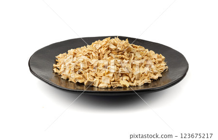 Dry parsley root, dried diced celery cubes, scattered small liquorice pileces, dry vegetable Dry parsley root, dried diced celery cubes, scattered small liquorice pileces, dry vegetable 123675217