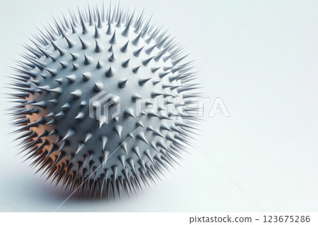 A spiked spherical object on a white background. Space for text. A spiked spherical object on a white background. Space for text. 123675286