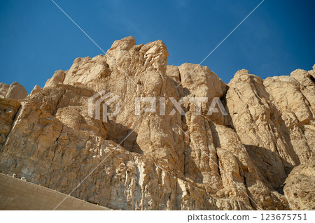 Rocks near the Temple of Hatshepsut on a blue background 123675751