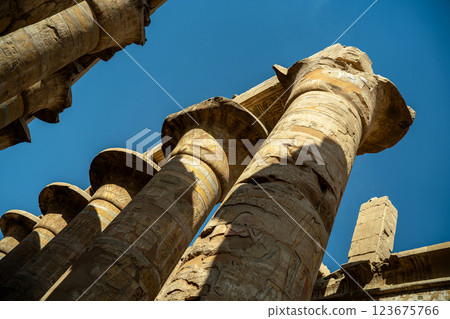 Egyptian columns statues with drawings in Karnak 123675766