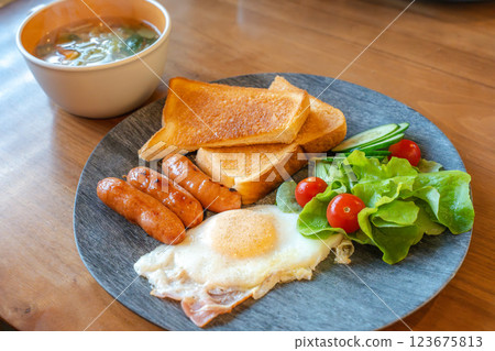 Western-style breakfast plate with toast and fried egg Western-style breakfast plate with toast and fried egg 123675813