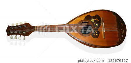 This domra features a beautifully crafted wooden body and neck, highlighting intricate designs. Ideal for showcasing its vibrant sound, the instrument is essential for traditional music. 123676127