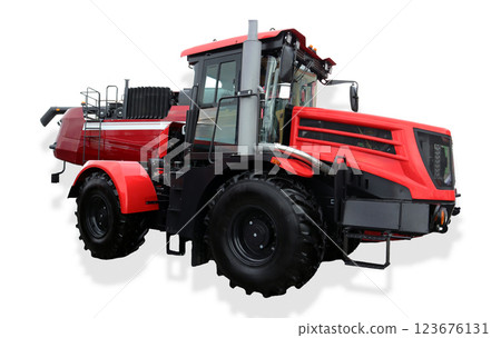 A universal farm tractor is seen working in agricultural fields, showcasing its robust design and capabilities. This powerful machine performs various tasks to support farming activities. 123676131