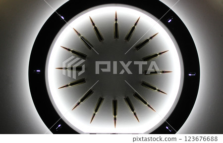 Perfect Circle Made Of Bullets With Soft Backlight From Ring Lamp  123676688