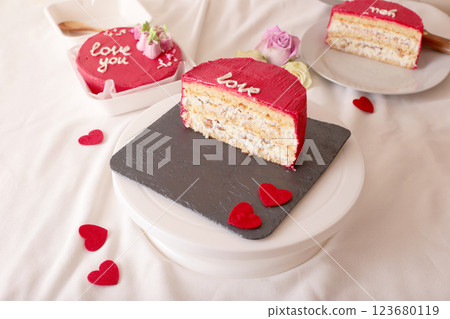 Romantic pink valentine's cake with love message and heart decorations 123680119
