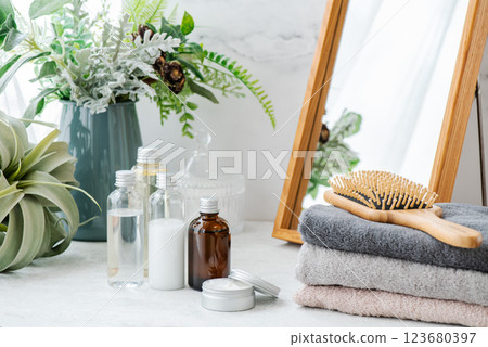 Image of morning care with clean towels and basic cosmetics 123680397
