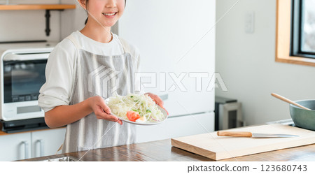 Child, girl, kid holding vegetables in kitchen (smile) Child, girl, kid holding vegetables in kitchen (smile) 123680743