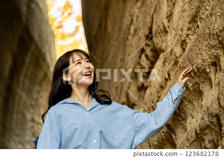 A woman travelling through the Torozaka Daishi tunnel A woman travelling through the Torozaka Daishi tunnel 123682178