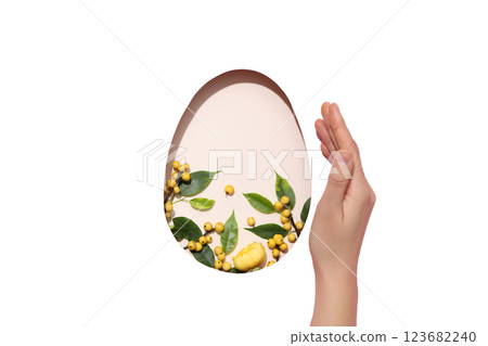 PNG, Easter, cut out egg shape with berries, with hand, on pink background, isolated on white background 123682240