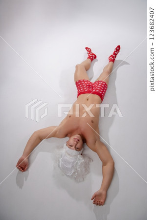 Couple engages in playful roleplay scenario with adult themes indoors 123682407