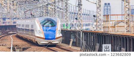 Joetsu Shinkansen/Hokuriku Shinkansen entering Omiya Station in Saitama Prefecture 123682809