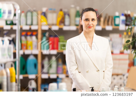 Woman seller offers cleaning products in store 123683197