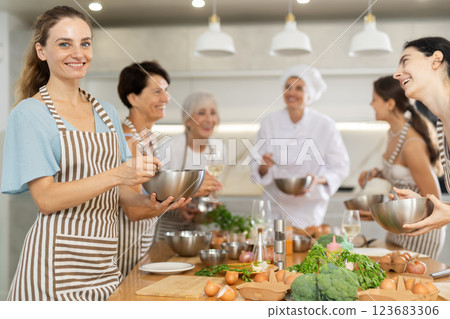 Young woman learns to cook at master class 123683306