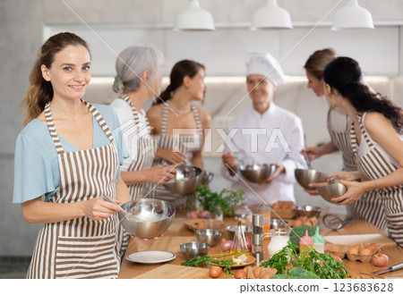 Young woman learns to cook at master class Young woman learns to cook at master class 123683628