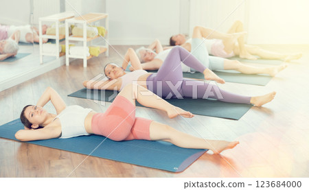 Young woman doing pilates in group 123684000