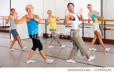 Various aged women dancing modern dance 123684104