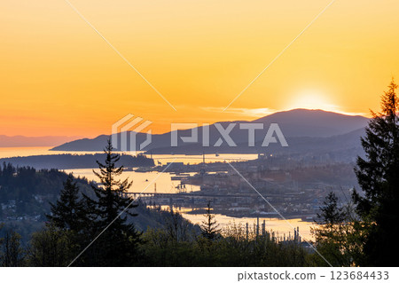 Burnaby Mountain Park in sunset time. Overlooking the upper arms of Burrard Inlet. Burnaby, BC, Canada. Burnaby Mountain Park in sunset time. Overlooking the upper arms of Burrard Inlet. Burnaby, BC, Canada. 123684433