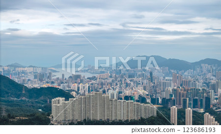 Feb 23 2025 A Buildings Overlooking Coastal Cityscape with Mountains 123686193