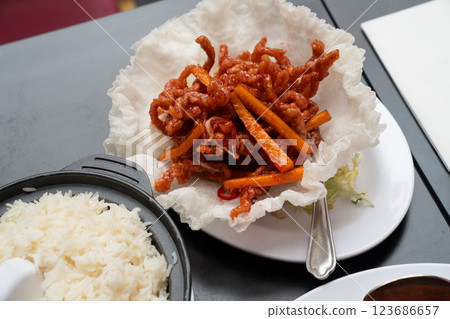 The basket adds an extra layer of texture to the savory shredded pork The basket adds an extra layer of texture to the savory shredded pork 123686657